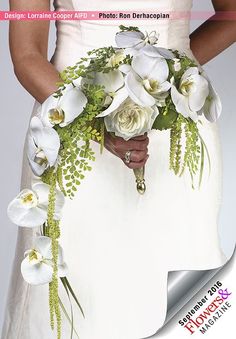 a woman holding a bouquet of flowers in her hands