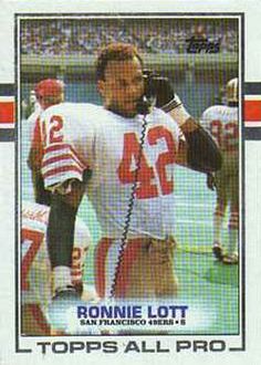 a football card featuring ronnie lott on the cover of topps all pro