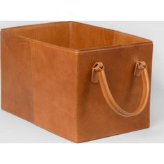 a brown leather storage box with handles