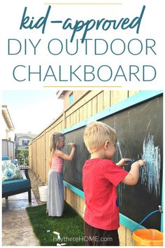 two children writing on a chalkboard with the words kid - approved diy outdoor chalkboard