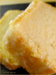 two pieces of cake sitting on top of a black plate with yellow border around the edges