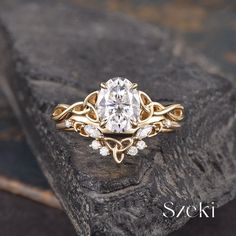 a close up of a diamond ring on a rock with the words seki written below it