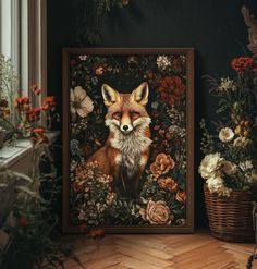 a painting of a fox surrounded by flowers in a frame on the floor next to a window