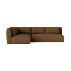 a large brown couch with pillows on it's back and armrests, in front of a white background