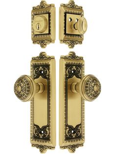 two golden door knobs with ornate designs on the front and back sides, both facing opposite directions