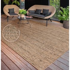 a living room with wicker furniture and plants