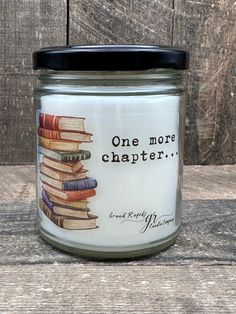 a jar filled with books sitting on top of a wooden table