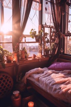 a bed sitting next to a window in a room with lots of plants on the windowsill