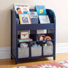 there is a book shelf with books and toys on it in the corner next to a wall