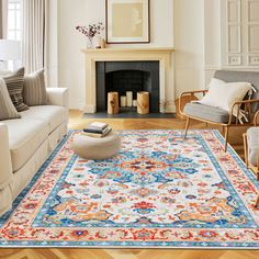 a living room with two couches and a rug on the floor in front of a fireplace