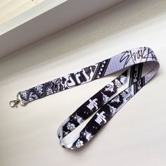 a lanyard with black and white images on it