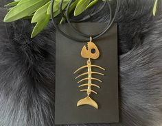 "Neck cord: 18\"  Pendant:  1-3/10\" by 3-3/8\".             33mm x 86mm  Beautiful  extra large fish bone necklace make a statement, it's wonderful for any occasion. The pendant is attached to an 18\" black silicone neck cord. If you've never seen these, they look similar to leather, but have a supple and silky feel. One end plugs into the other. Very cool. Thanks for looking! Please see shop policies and ask any questions you might have before purchasing. Orders ship within 24 hours and all pa Grunge Chokers, Fish Bone Necklace, Nautical Necklace, Horse Earrings, Bone Necklace, Boho Choker, Black Choker, Fish Bone, Unisex Jewelry