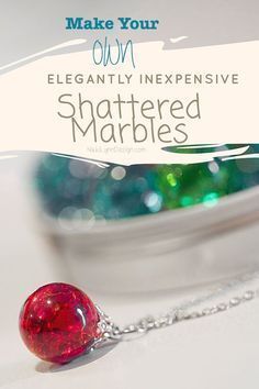 a close up of a red ball on a chain with the words, make your own elegantly expensive shattered marbles