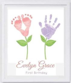 two handprints with the words evelyn grace first birthday and an image of a flower