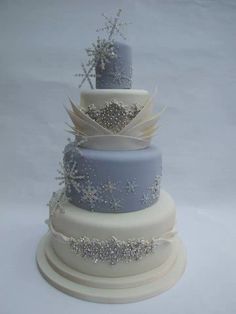 a three tiered cake with frosting on top