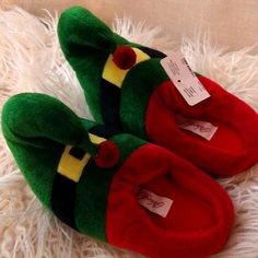 Grab These Today For The Season New With Tags By North Pole Trading Co. Soft Fuzzy Warm Elf Slip On Slippers With Character Design Kids Sized - S/M Length 6.5 Inches Long Wide 3 Inches Across The Toe Pad For Toddler Kids & M/L Toddlers In Kids Sizes 7 Inches Long & 3 Inch Wide Cross The Toe Pad Machine Washable More Kids Items And Shoes Available Bundle And Save Cute Green Non-slip Slippers, Cute Green Slippers With Round Toe, Playful Green Slippers With Round Toe, Fun Multicolor Round Toe Slippers, Casual Christmas Slippers With Round Toe, Ll Bean Slippers, Minnie Mouse Slippers, Dearfoam Slippers, Minnetonka Slippers