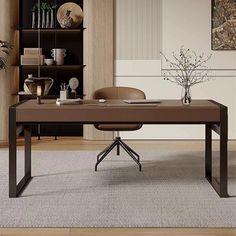 an office with a desk, chair and bookcase in the corner on carpeted flooring