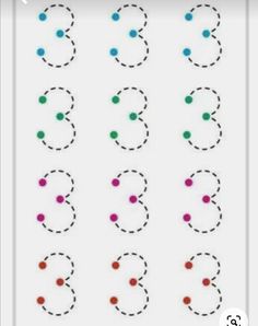 an image of numbers and dots on a white sheet with red, blue, green and black circles