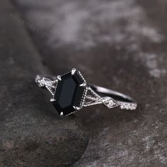 This is a vintage Long hexagon cut black onyx and moissanite engagement ring in sterling silver. Perfect birthday gift, bridal gift, Anniversary gift, wedding ring. Main Stone: 9x5mm hexagon cut black onyx. Side stone: Moissanite This ring is marked S925/G10K/G14K (According to the metal option) I accept custom making order.Please contact me if you need this service. For all the jewelries,there is a 14 days money back guarantee. You can return it in the time frame without any questions.However t Vintage Onyx Ring Silver, Black Diamond Engagement Ring Gothic, Silver Rings With Black Stones, Dark Stone Wedding Ring, Black Stone Engagement Ring Silver, Black Onyx Ring Vintage, Onyx Promise Ring, Black Crystal Engagement Ring, Black Engagement Rings Diamond