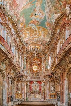 the interior of an old church with painted ceilings