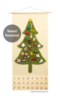 a green christmas tree on a wall hanging from a white wall with numbers and pins