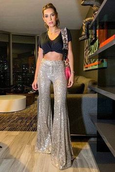 I can personally guarantee these will be one of the most complimented items you ever wear...speaking from personal experience. These eye catching flares are fully lined with a buttery soft maters (absolutely no scratchiness,) a silvery sequin over champagne making them versatile to wear with any top, zipper & hook front closure, elastic waist for comfort, and literally a perfect fit for any occasion. Sizing: SMALL 1-5, MEDIUM 5-9, LARGE 9-13 Approx. 35" inseam, easy hem Studio 54 Party Outfits, Sparkly Pants, Office Party Outfits, Nye Outfits, Sequin Pants, Eve Outfit, Disco Outfit, New Years Eve Outfits, Flare Leg Pants