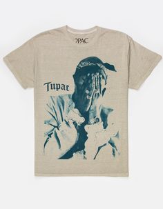 Tupac Me Against The World Tee. Large Graphic On Front. Large Text Screened On Back. Crew Neck. Short Sleeve. 100% Cotton. Machine Wash. Imported. 2pac Graphic Tee, Graphic Tees Tupac, Shirts You Need, Graphic Tees For Women Latest Trends, Graphic Tees Rappers, Rapper T Shirts, Grafic Tees Print, Graphic Tee Men Outfit, Winter Graphic Tees