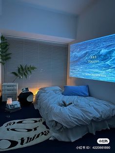 a bed room with a large screen on the wall and a plant in the corner