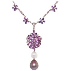 The lavender sapphire and diamond necklace features a spray of marquise shape faceted sapphires spangled with a crown of round diamonds. The jewel suspends an intermediary South Sea pearl and a Tahitian pearl of the rare size of 19 x 16mm. The 3.25” pendant is accompanied by a 15” chain decorated with lavender sapphire and diamond flowers. The total weight of sapphire is 25 carats; the total diamond weight is 1.92 carats. The pendant is detachable, allowing for versatile use. All of our pearls are untreated: their natural color and luster have not been enhanced in any way. All of our diamonds are of top quality (F/G-VVS). The pendant is one-of-a-kind. It was handmade in Italy in our own workshop by maestro Scalabrì according to an original design by Ella Gafter. The item is signed EG. Lavender Sapphire, Sapphire Diamond Necklace, Lavender Necklace, Fish Pendant Necklace, Sapphire Diamond Pendant, Diamond Drop Necklace, Sapphire Necklace Pendants, Drop Pendant Necklace, The Jewel