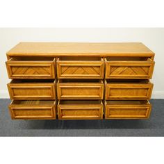 a large wooden dresser with six drawers