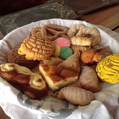 a basket filled with different types of pastries