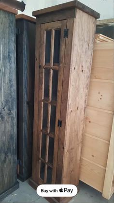 two wooden cupboards sitting next to each other