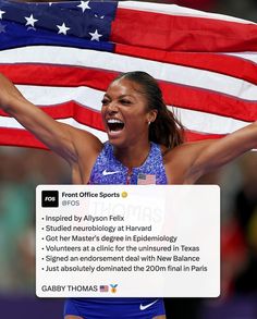 a woman holding up an american flag