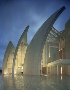 an architecturally designed building lit up at night