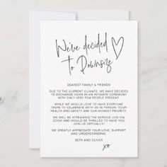 a white card with the words we are decided to pursue written in cursive ink