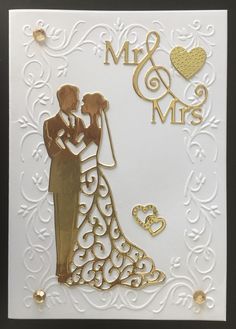 a wedding card with the silhouette of a bride and groom holding each other's hand