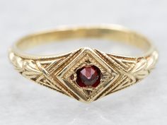 This is a pretty piece from the late 1800s. The gold is warm, with a pretty rose tint; a perfect complement to the small garnet center of the band. The garnet is a dark blood-red hue with a wonderful deep crimson sparkle. Metal: 10K Yellow GoldGem: GarnetGem Measurements: 1.7 mm, RoundRing Size: 1Marks: "10K(Church)" Stamped on the inside band Victorian Rings Vintage, Garnet Wedding Rings, Garnet Ring Vintage, Jewelry Stacking, Victorian Engagement Rings, Antique Jewelry Rings, Pretty Rose, Garnet Gem, Dark Blood