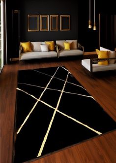 a living room with black walls and yellow accents on the rug is pictured in this image