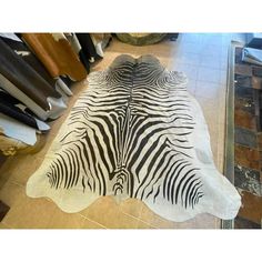 a zebra print rug on the floor in a store