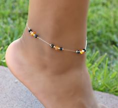 Anklet is made with 4x6mm orange crystals, 4mm black crystals on a clear stretch cord for easy fit. Crystal Falls, Crystal Anklet, Anklet Designs, Beautiful Anklet, Beaded Ankle, Swarovski Crystal Jewelry, Orange Crystals, Crystal Bangle, Beaded Anklets