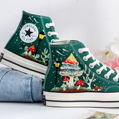 Welcome to LunnNest, a hand embroidered items shop. These are the most meticulously embroidered shoes that I give to you. I embroider them carefully and thoroughly with skillful hands. Converse type: Converse High Tops Chuck Taylor 1970s Converse color:  7. 1970s_Green Price includes: Shoes + Embroidery as Pictured I can buy it for you at a store near your home or you can send me the canvas shoes you have available. Your embroidered Converse, Vans shoes are ready to ship in 8-16 days. I need this kind of time to meticulously complete the product before handing it over to the shipping unit to ship to you. I started learning embroidery when I was an elementary school student. I enjoyed watching my mother embroider flowers and butterflies on her shirt and handbag. Now I embroider such pattern Green Embroidered Converse, Cool Converse High Tops, Christmas Mushrooms, Mushrooms Embroidery, Embroidered Converse High Tops, Converse Types, Learning Embroidery, Cool Converse, Artistic Clothing