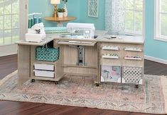 a sewing machine sitting on top of a wooden table next to a rug and window