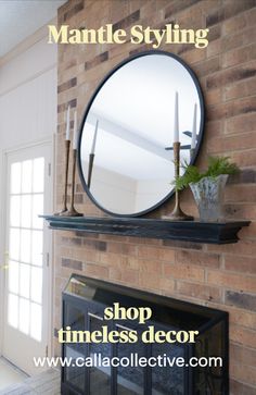 a fireplace with a round mirror above it