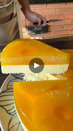 a person cutting cheese on top of a white plate