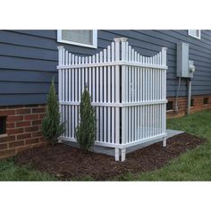 a white picket fence in front of a house