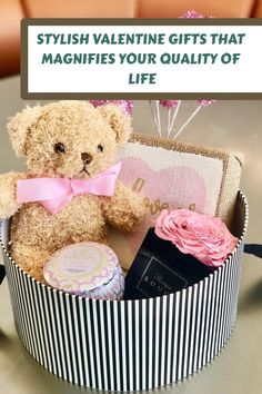 a teddy bear sitting in a gift box