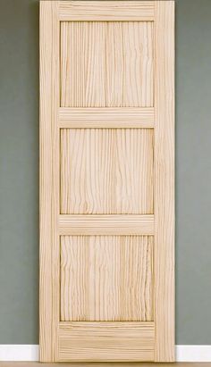 a wooden door is shown against the wall