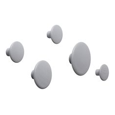 five white round knobs on a white background