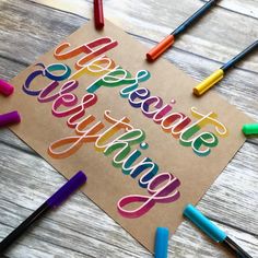 some crayons are laying on top of a piece of paper that says celebrate giving