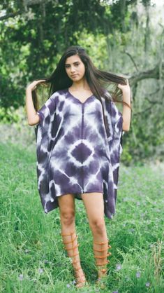 Eggplant purple Shibori tie-dyed festival dress tunic coverup poncho. Fits sizes 2 to 12. Model is 5'7"and wears size 4. Purple Short Sleeve Kaftan For Beach, Flowy Summer Poncho For Beach Cover-up, Purple Bohemian Tunic For Spring, Bohemian Purple Tunic For Spring, Casual Purple Tunic Kaftan, Summer Beach Poncho With Relaxed Fit, Bohemian Short Sleeve Poncho For Spring, Summer Vacation Poncho With Short Sleeves, Summer Beach Poncho In Relaxed Fit